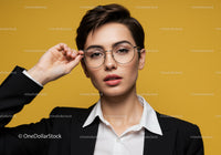 Stylish Woman with Short Dark Hair and Round Glasses in Contemporary Portrait