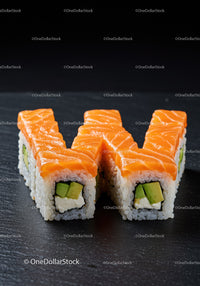 Fresh salmon sushi rolls with avocado and cream cheese