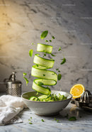 Fresh cucumber ribbons with herbs in rustic bowl