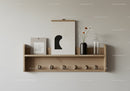 Wooden Floating Shelf with Vase Flowers and Glass Bottle on Neutral Wall