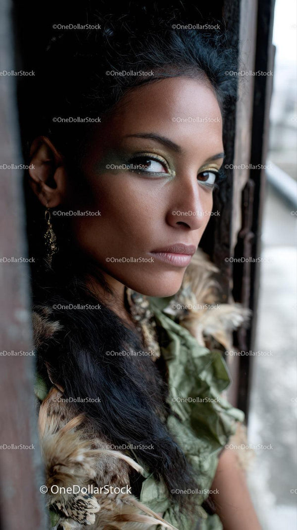 Expressive Female Portrait with Green and Gold Eye Makeup
