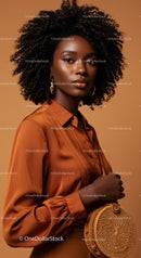 Elegant African American Woman in Satin Blouse with Curly Hair and Gold Earrings