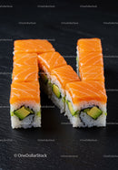 Fresh Salmon Avocado Sushi Rolls on Black Slate