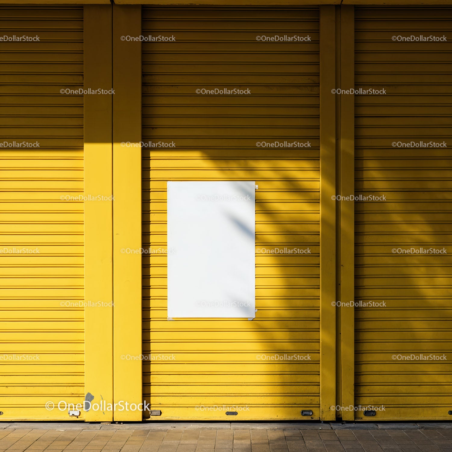 Blank white poster on bright yellow metal shutters