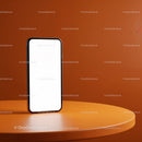 Modern smartphone standing on vibrant orange table