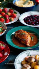 Roasted turkey leg with sides and fresh strawberries