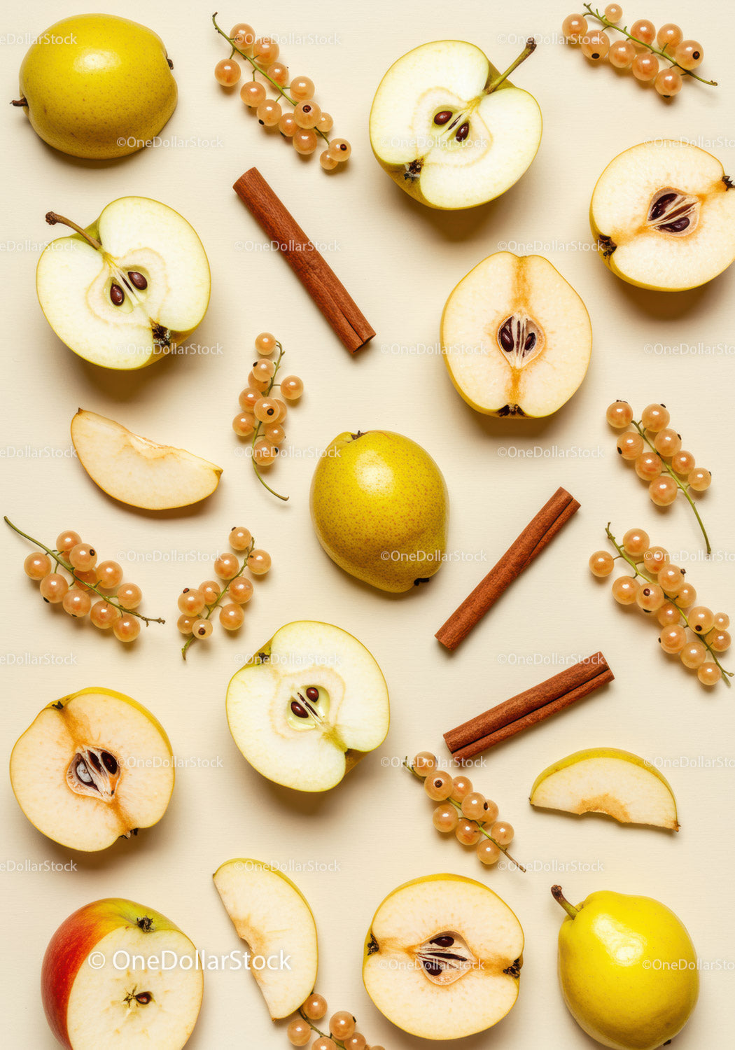 Autumn fruits and cinnamon sticks arranged on beige background