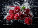 Fresh Raspberries in Water with Splash Effect and Bubble Details