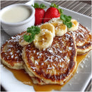 Delicious Banana and Strawberry Pancakes with Syrup and Toppings