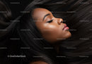 Profile of serene woman with flowing black hair