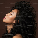 Profile of serene woman with flowing curly hair