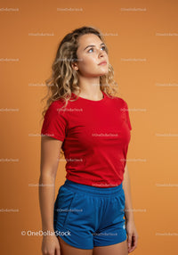 Young woman wearing casual sportswear looking upward