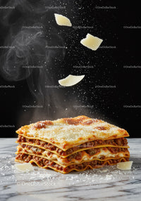 Classic layered lasagna sprinkled with parmesan cheese