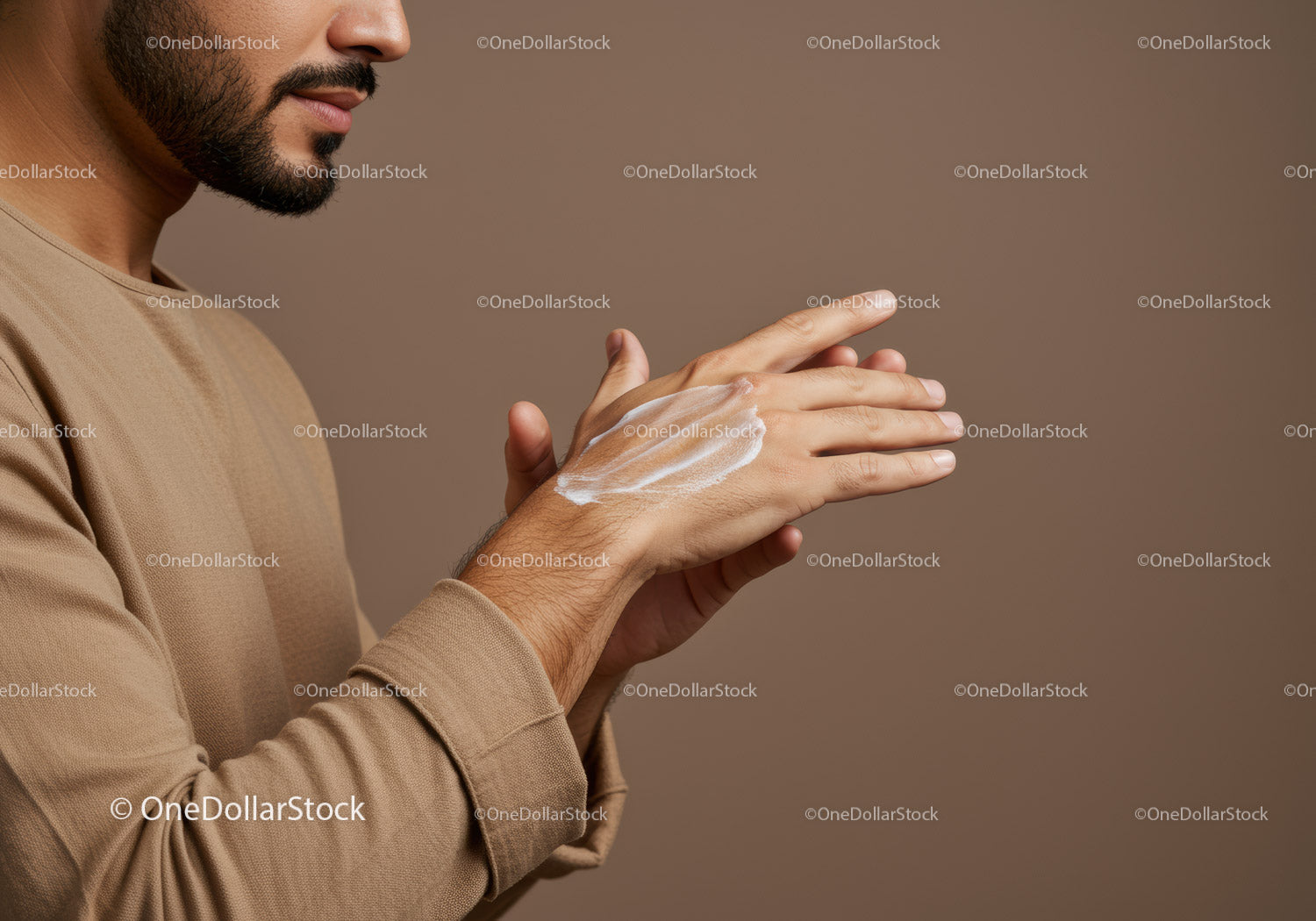 Man Applying Lotion with Hand Cream in Skincare Routine