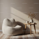 Cozy textured armchair next to wooden side table