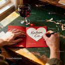 Man Handwriting Romantic Love Note with Glass of Red Wine