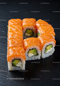 Fresh salmon sushi rolls with avocado and cream cheese