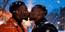 Two men share a tender kiss on a snowy evening