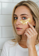 Woman Applying Hydrating Under-Eye Patches for Skin Rejuvenation