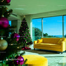 Modern Living Room with Festive Christmas Tree and Yellow Sofa