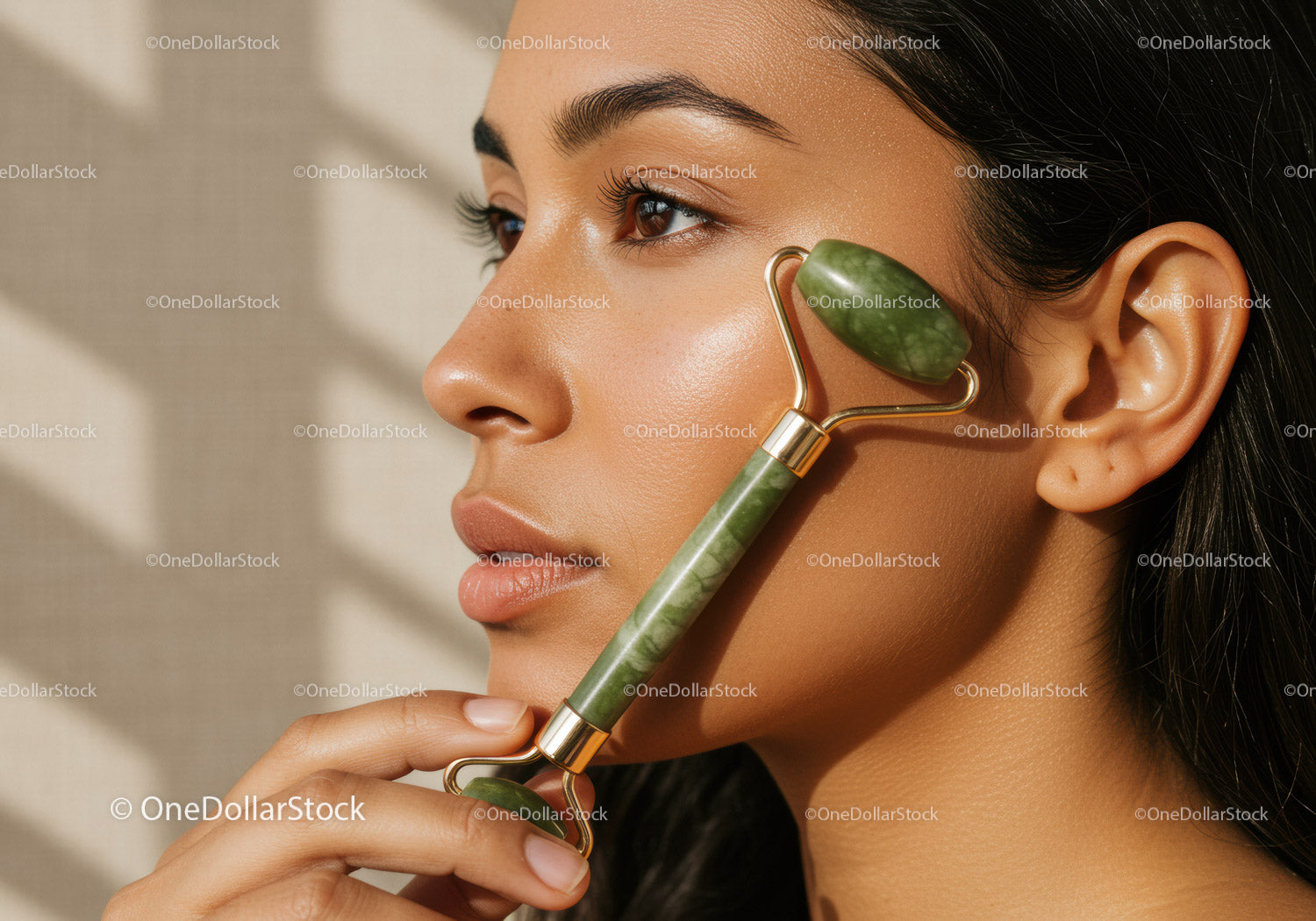 Close-up of Woman Using Jade Roller for Facial Skincare