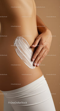 Close-up of a Woman Applying Moisturizer on Body Skin