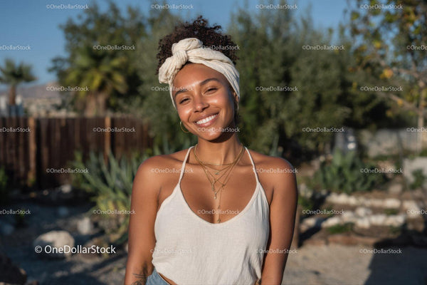 Smiling Woman Wearing Layered Necklaces Outdoors in Summer