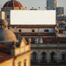 Couple enjoying urban rooftop beneath large blank billboard