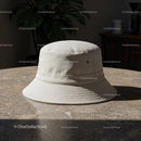 Neutral beige bucket hat on textured stone table