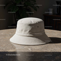 Neutral beige bucket hat on textured stone table