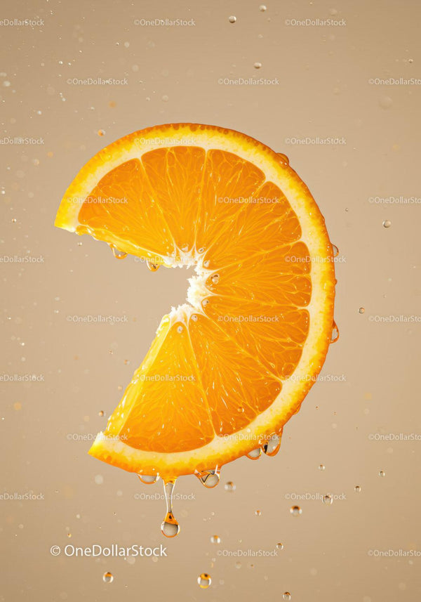 Fresh orange slice dripping with juice in water splash