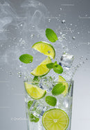 Refreshing lime and mint splash in iced water glass