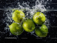 Green Apples Splashing Water Into Lake Creating Fresh Juicy Scene