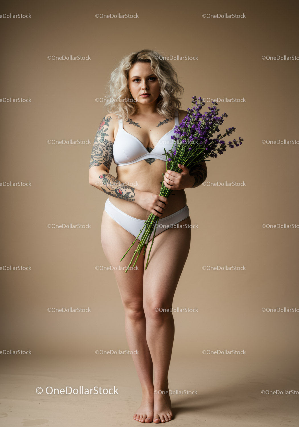 Tattooed Woman in Lingerie Holding Lavender Bouquet in Studio