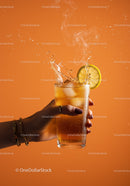 Refreshing iced tea with lemon slice and splash effect