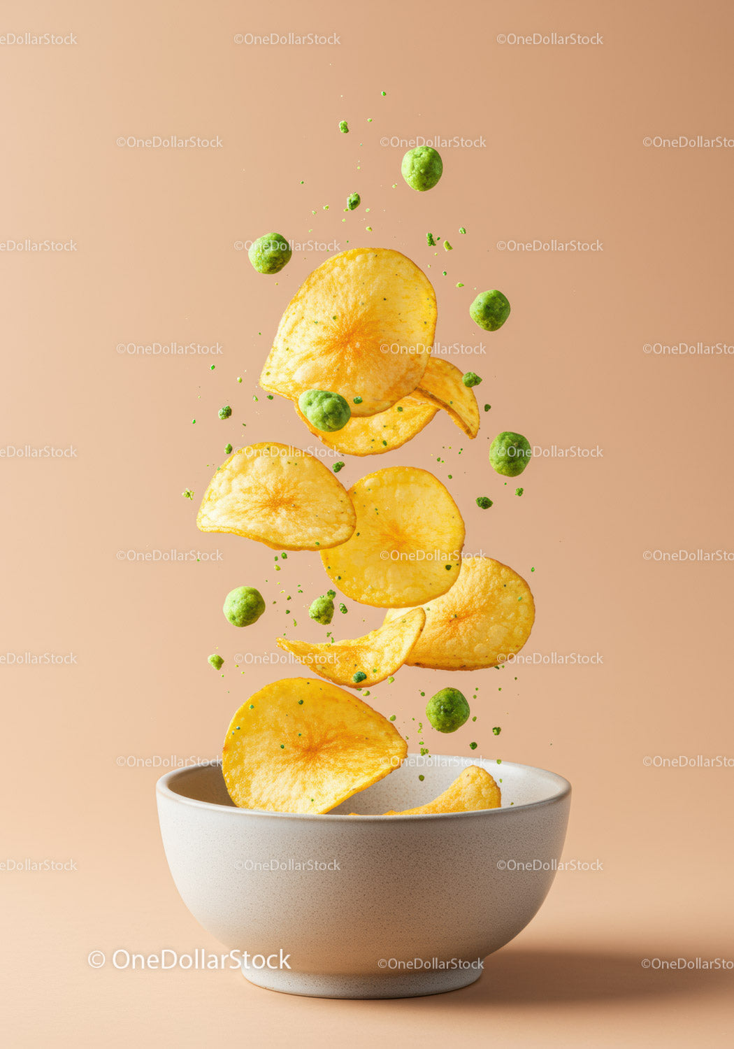 Potato Chips and Peas Falling into White Bowl