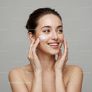 Young Woman Applying Facial Moisturizer for Healthy Glowing Skin