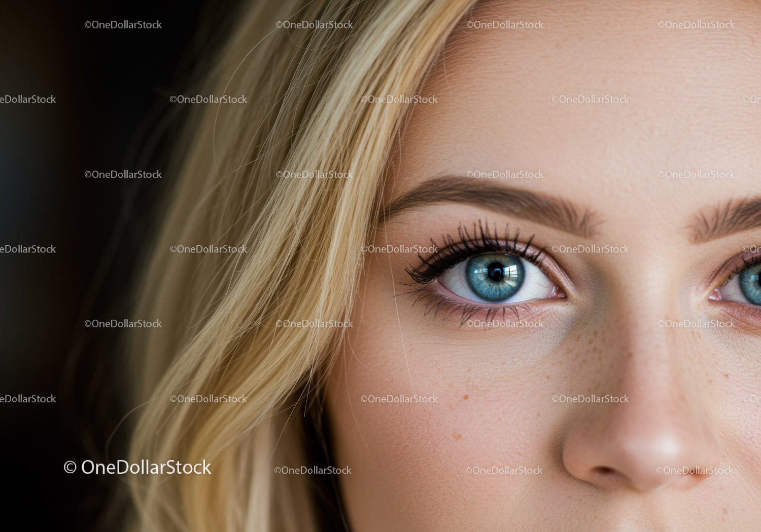 Close up of blue eyes with natural blonde hair