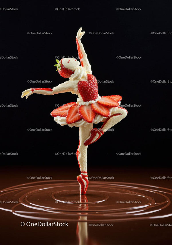Strawberry ballerina sculpture dancing on chocolate surface