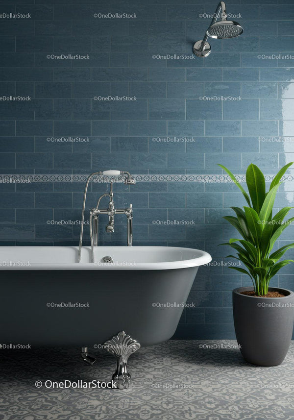 Elegant freestanding bathtub with green potted plant
