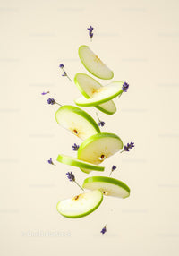 Floating green apple slices with lavender flowers