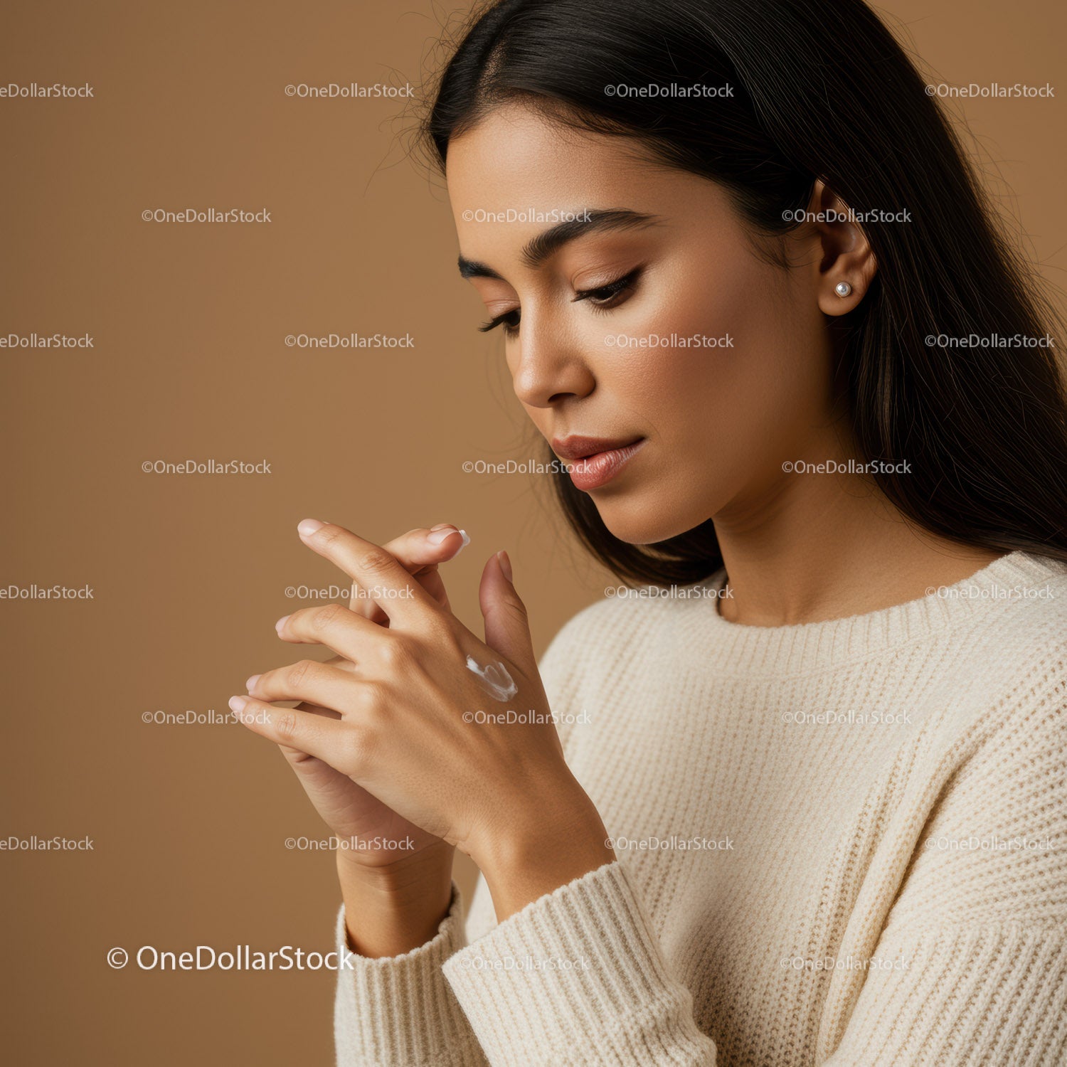 Elegant Woman Applying Hand Cream for Skincare Routine