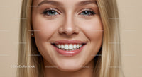 Close up of smiling young woman with clear skin