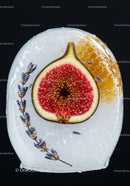 Frozen fig and honeycomb with lavender in ice block