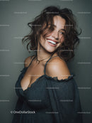 Joyful Woman with Wavy Hair Wearing Dark Blouse