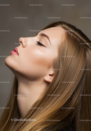 Profile of a calm young woman with flawless skin
