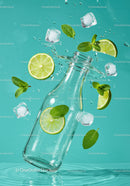 Refreshing lime and mint splash with ice cubes in glass bottle