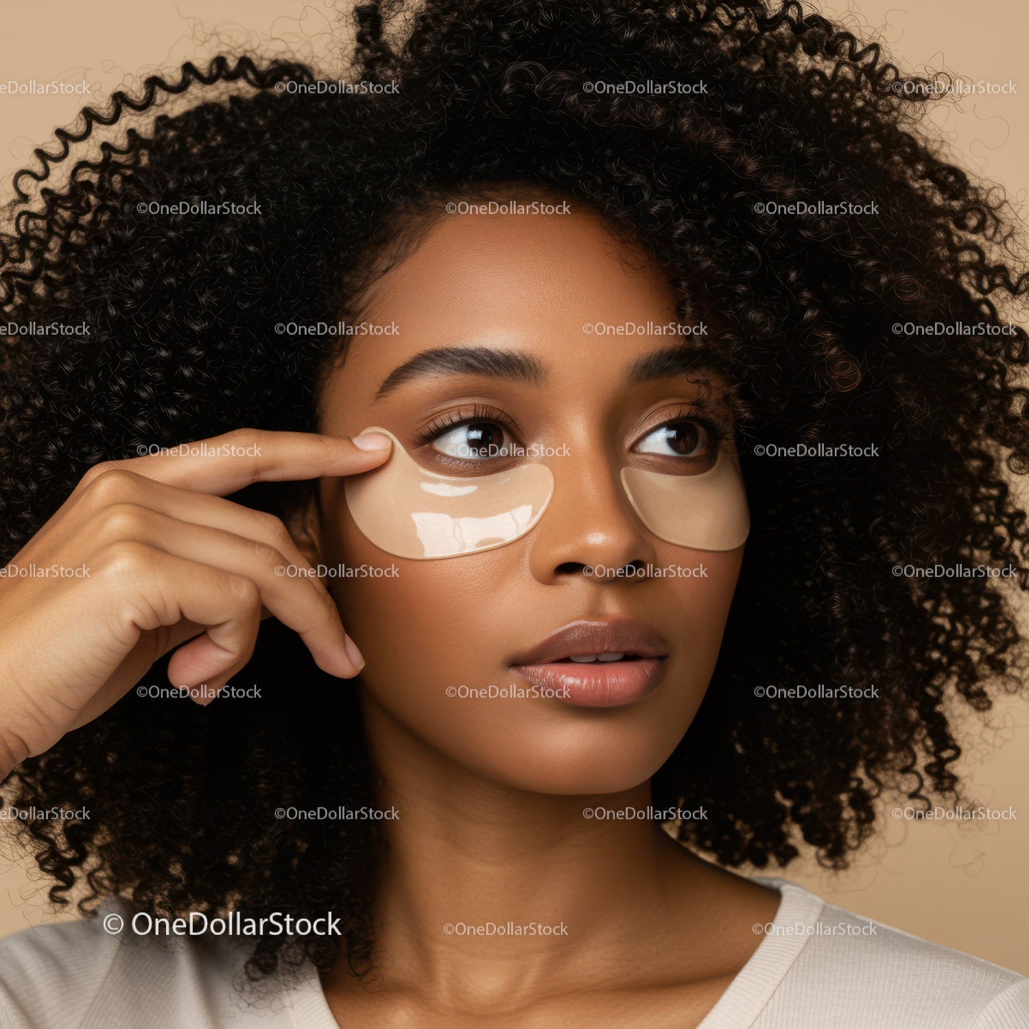 Young Woman Applying Under-Eye Patches for Skincare and Beauty