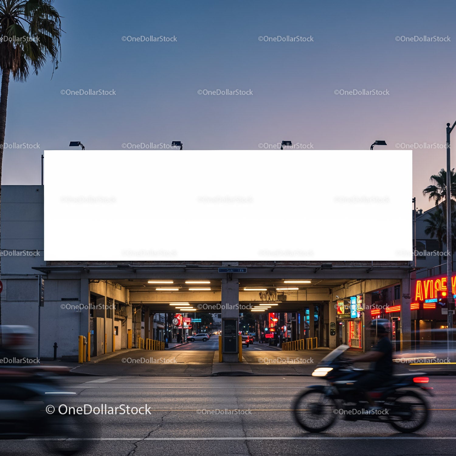 Empty illuminated billboard above city street at dusk