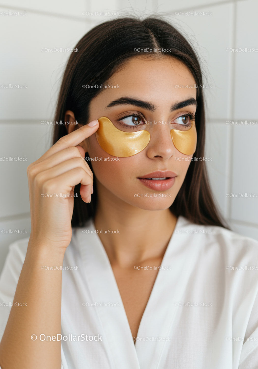 Young Woman Applying Under Eye Patches for Beauty and Relaxation